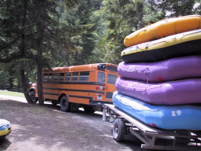 Our rafts behind an original American school bus ("cheese wagon")