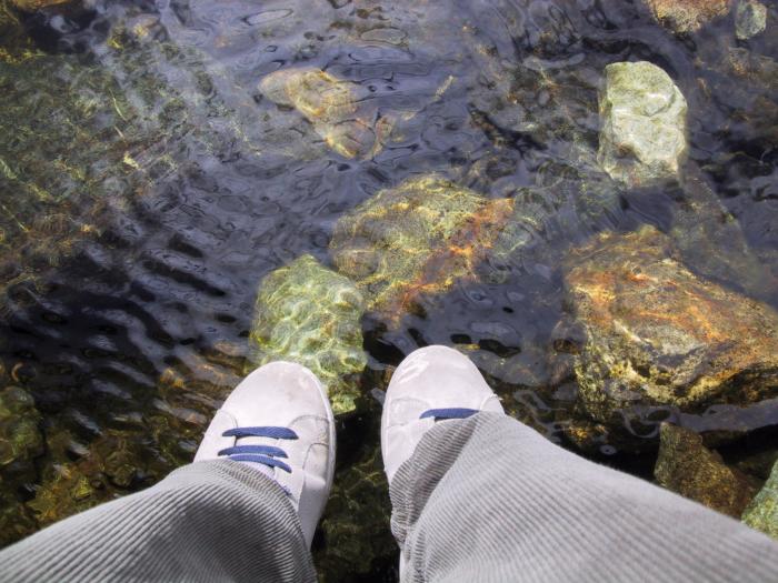 My feet hanging off a bridge