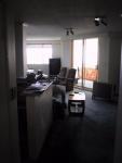 You see this when you enter. There's the bar, the TV couch...
